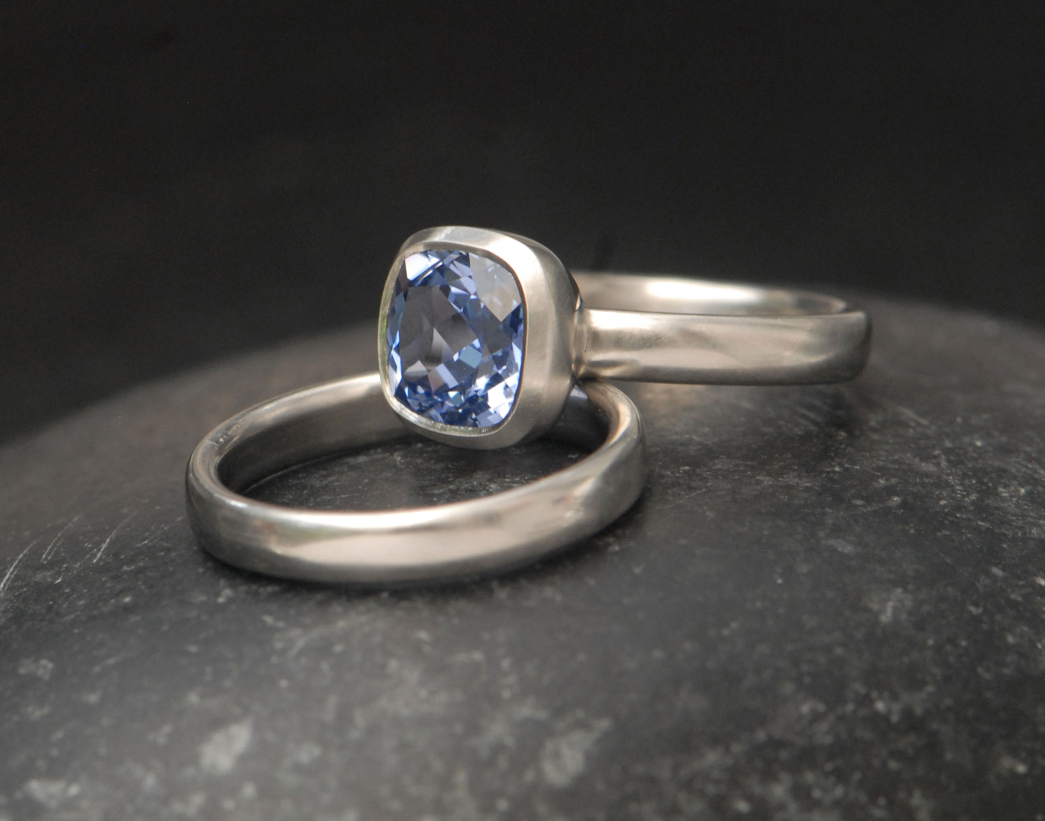 lab-sapphire-light-blue-8mm-cushion-cut-wedding-set-in-platinum-on-hand