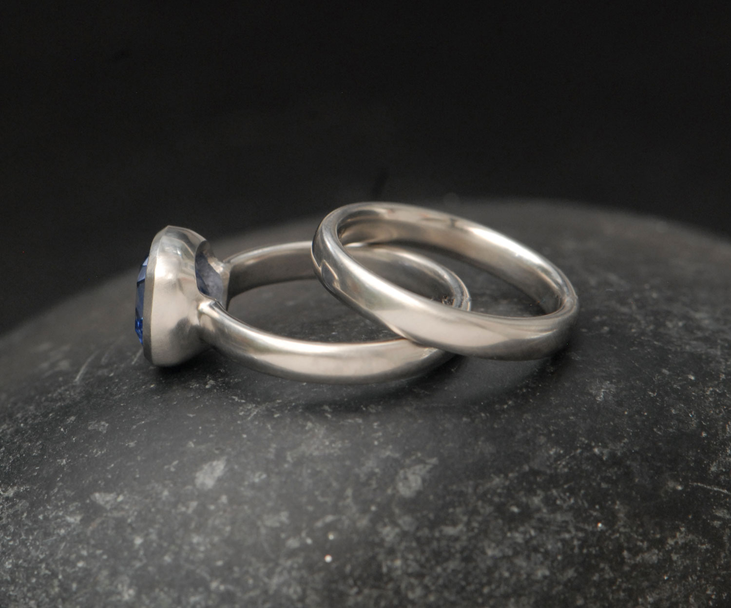 lab-sapphire-light-blue-8mm-cushion-cut-wedding-set-in-platinum-on-hand