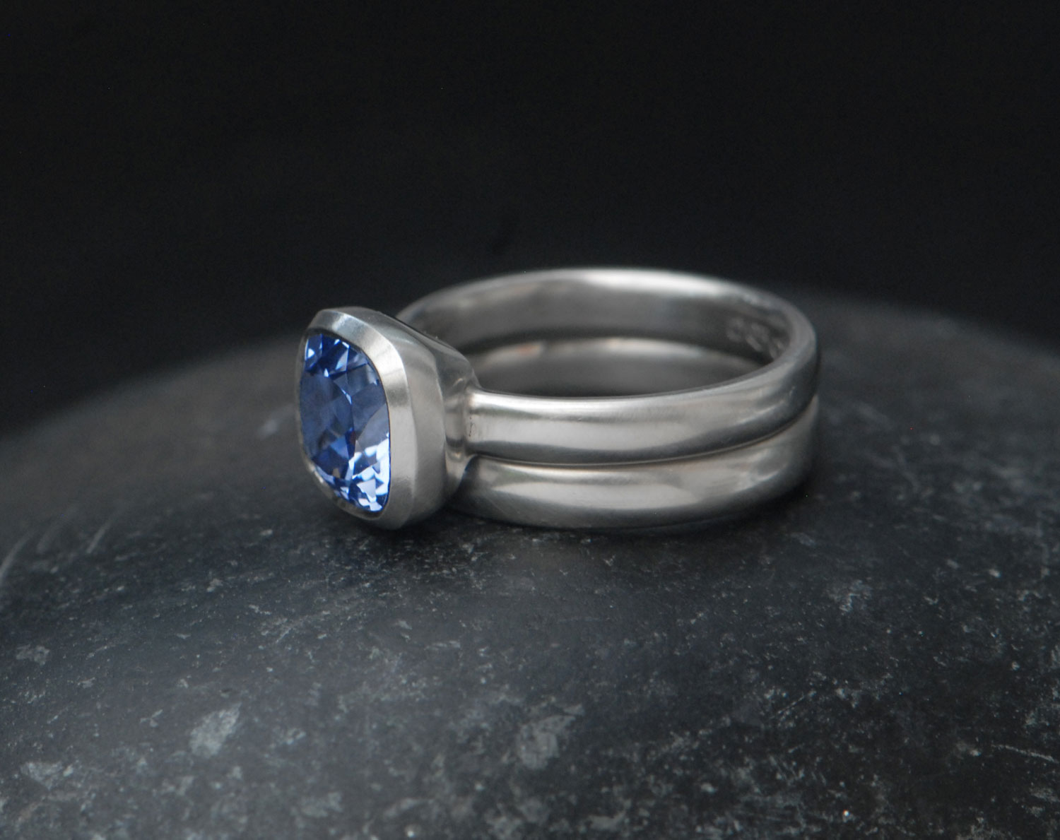lab-sapphire-light-blue-8mm-cushion-cut-wedding-set-in-platinum-on-hand