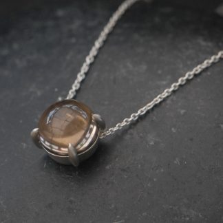 smoky-quartz-10mm-dragons-eye-necklace-in-silver-from-side